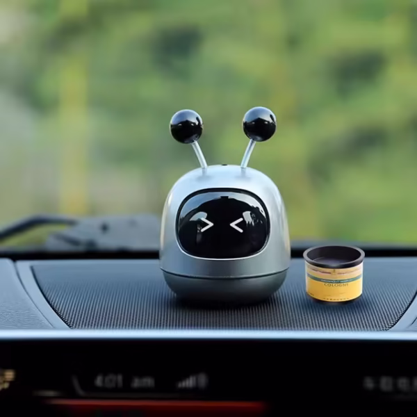 robot car air freshener, dashboard perfume, cute car decor, car fragrance diffuser, car interior freshener, blue robot air freshener, novelty car accessory, car odor eliminator, gift for car lovers, car dashboard ornament