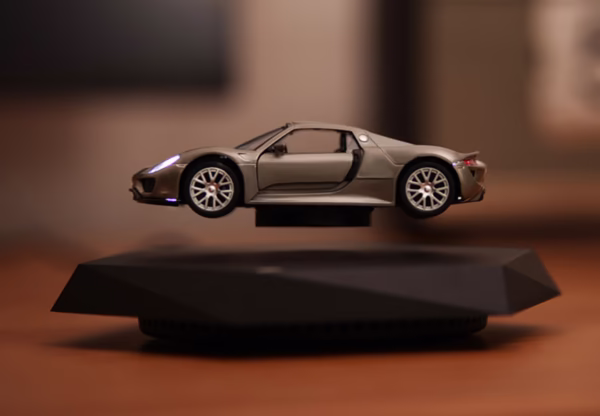 floating car display, magnetic levitation car, desktop car model, levitating car ornament, car enthusiast gift, spinning car display, collectible car decor, black base levitation stand, futuristic display piece, tech desktop ornament-nic-home-decor, wholesale-bd, best-price-bd, best-products-in-bd, gifts-and-unique, nic-wall-e-tissue-holder, unique-home-decor-bd, robot-tissue-box-bd, disney-merchandise-bangladesh, quirky-gift-ideas-bd