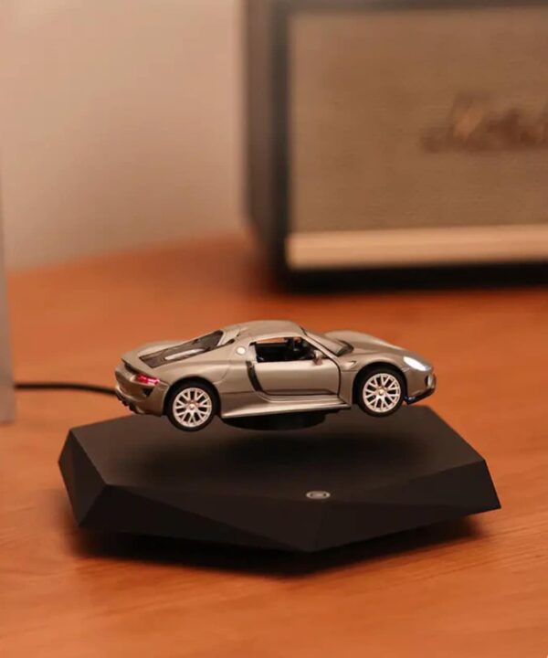 floating car display, magnetic levitation car, desktop car model, levitating car ornament, car enthusiast gift, spinning car display, collectible car decor, black base levitation stand, futuristic display piece, tech desktop ornament-nic-home-decor, wholesale-bd, best-price-bd, best-products-in-bd, gifts-and-unique, nic-wall-e-tissue-holder, unique-home-decor-bd, robot-tissue-box-bd, disney-merchandise-bangladesh, quirky-gift-ideas-bd