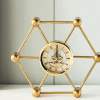 heavy golden skeleton clock, roman numeral desk clock, office desktop timepiece, gold skeleton clock, nicdecor.com, nichomedecor, luxury desk clock, unique gift idea, decorative skeleton clock, elegant office decor