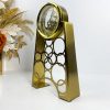 gold ring clock, mechanical table clock, decorative ring clock, vintage ring timepiece, polished gold clock, desk decor clock, minimalist ring clock, nicdecor.com, nichomedecor