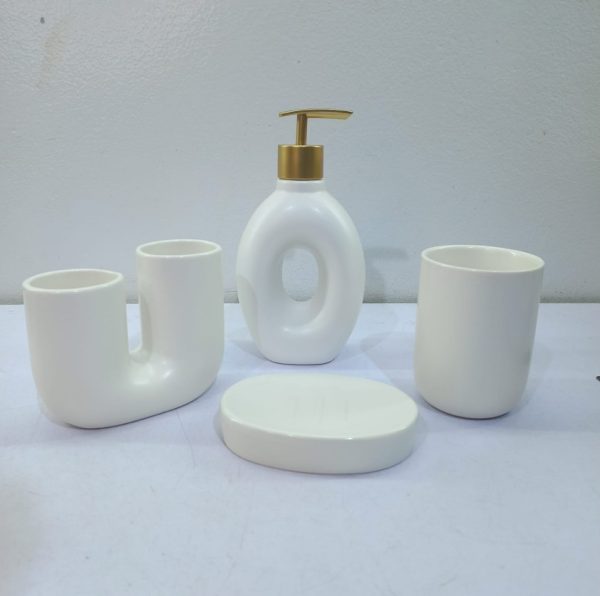 White ceramic bathroom accessory set