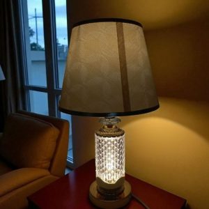 Metal body with acrylic design & brown fabric shade table lamp